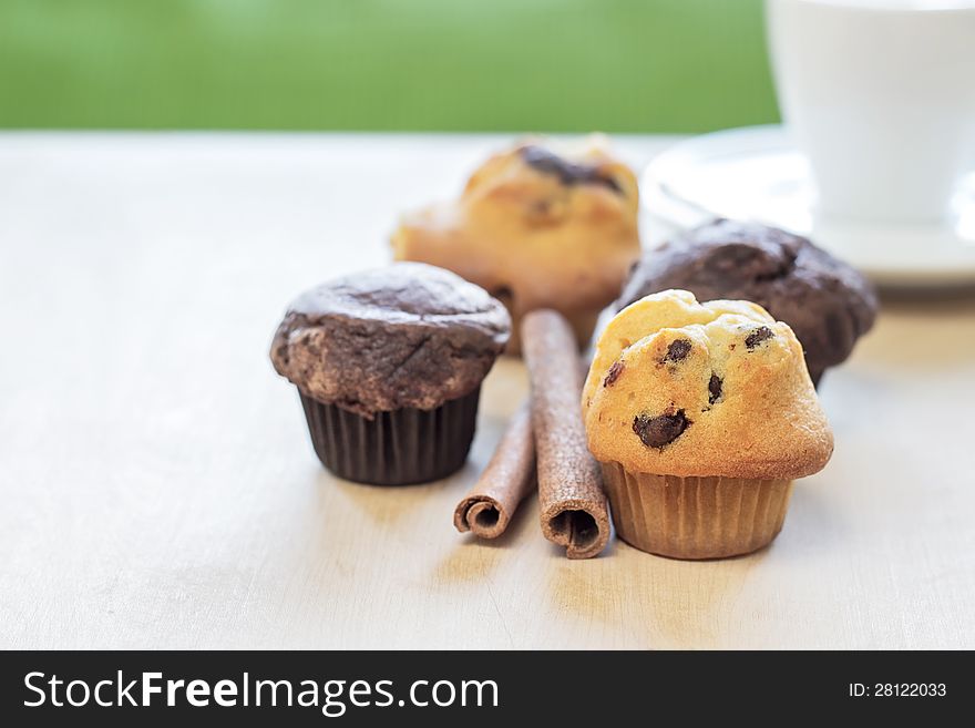 Chocolate chip muffin on wooden table