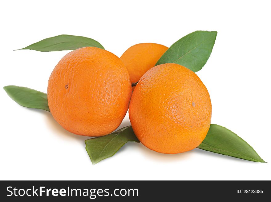 Fresh tangerines with green leaves