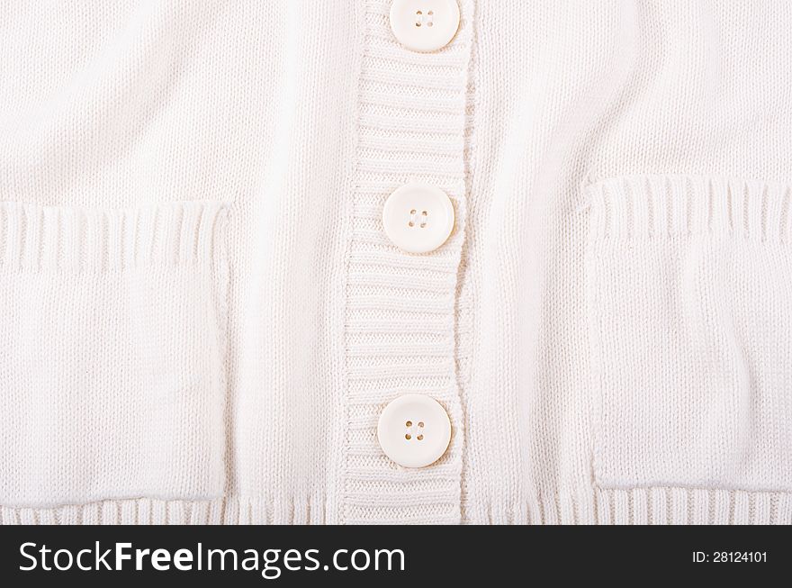 Knitted white jersey texture with a button