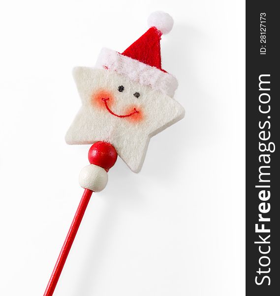 Smiling star-shaped Christmas decoration with Santa Claus cap