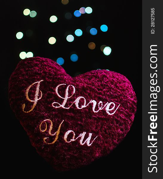 Soft heart with text I love you on bokeh lights background