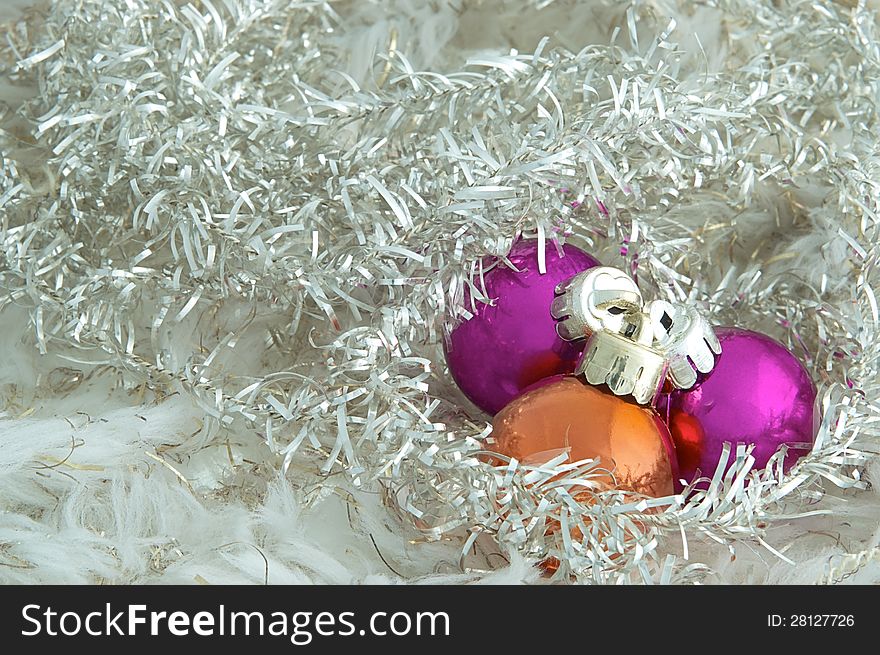 Three Christmas ornaments on a Christmas tree. Three Christmas ornaments on a Christmas tree