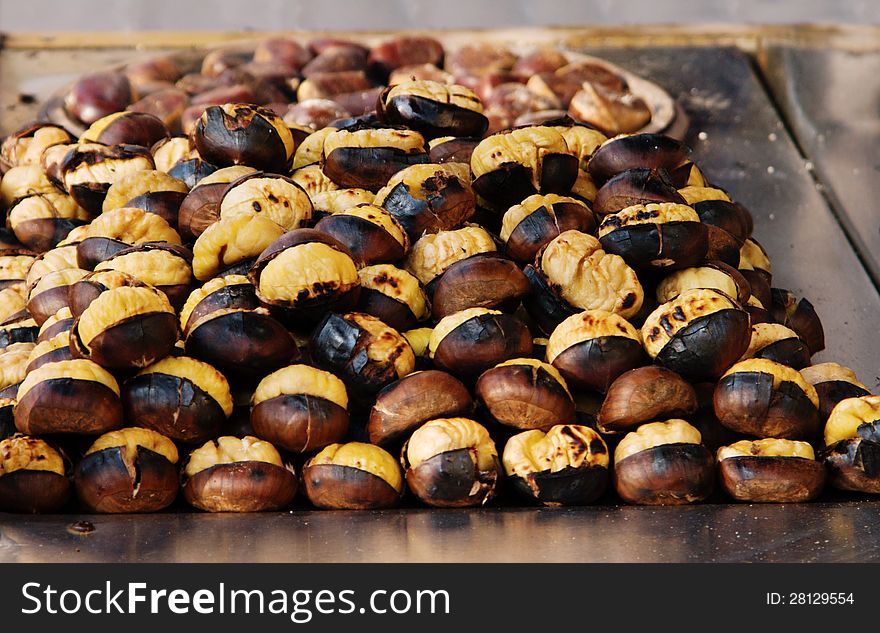 Grilled chestnuts on a roaster table
