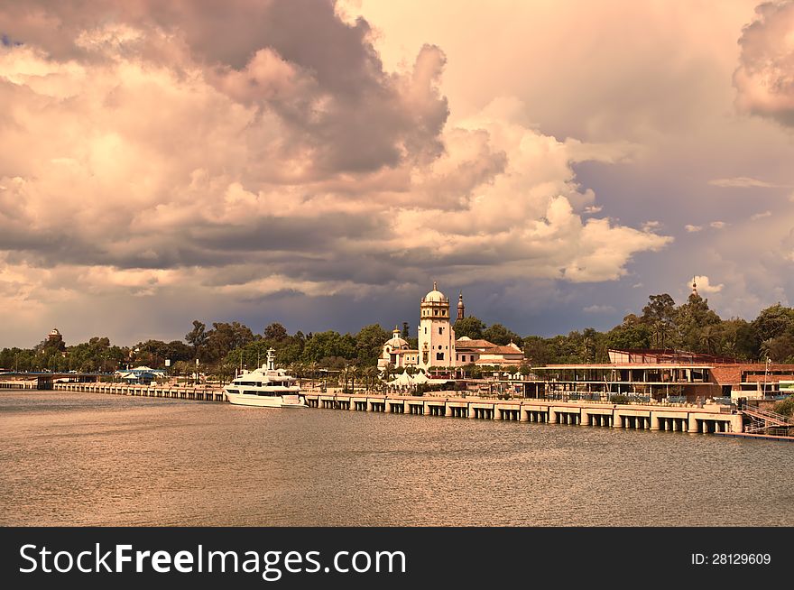 Guadalquivir river with cloudy sky as background. Guadalquivir river with cloudy sky as background