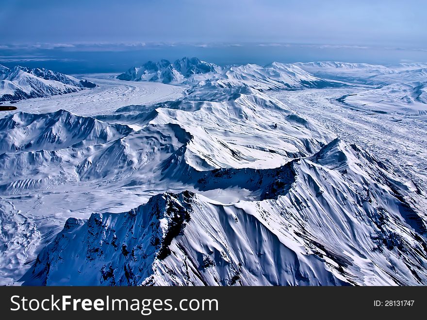 Aerial View of a River of Ice Flowing to the Sea.  Denali National Park, Alaska. Aerial View of a River of Ice Flowing to the Sea.  Denali National Park, Alaska.