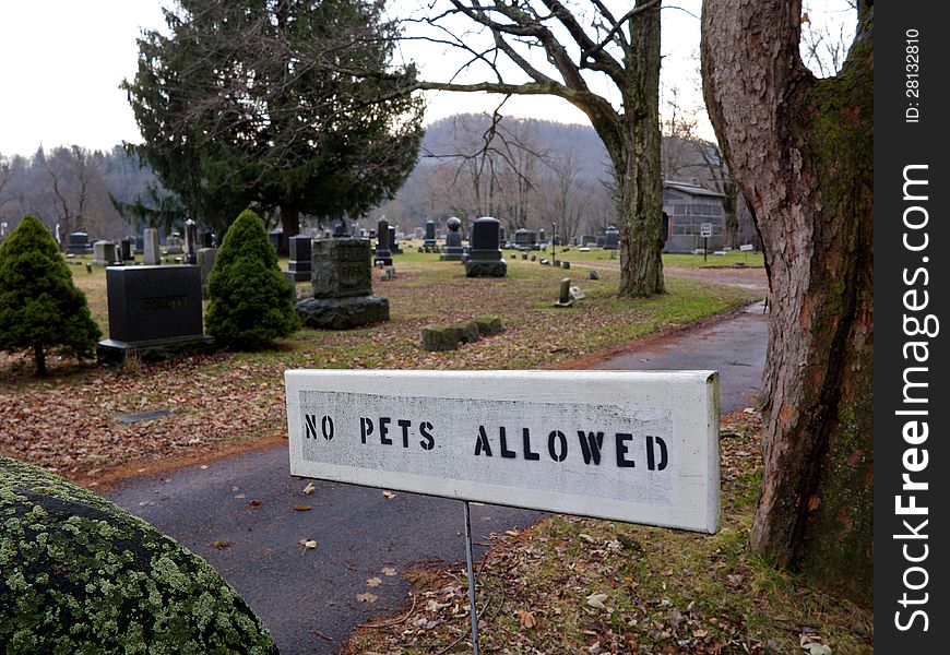 No pets allowed sign is shown at entrace to cemetery. No pets allowed sign is shown at entrace to cemetery.