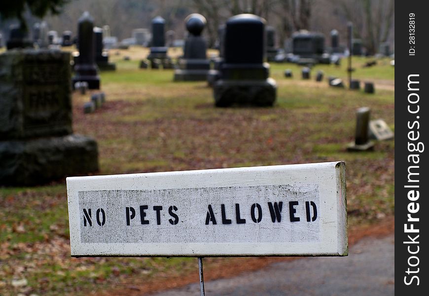 No pets allowed sign is shown at entrace to cemetery. No pets allowed sign is shown at entrace to cemetery.