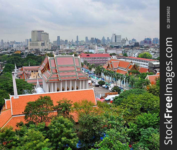 An aerial view of the Bangkok temple district from the Golden Mount (Wat Saket), Thailand. In The background is the city CBD. An aerial view of the Bangkok temple district from the Golden Mount (Wat Saket), Thailand. In The background is the city CBD.