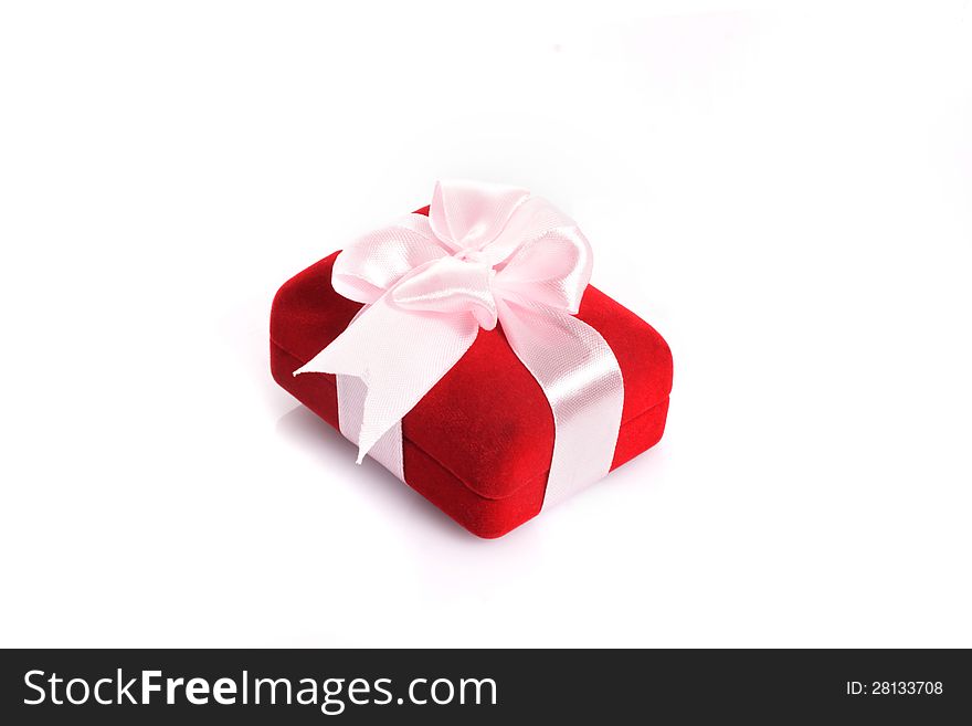 Gift with pink ribbon on white