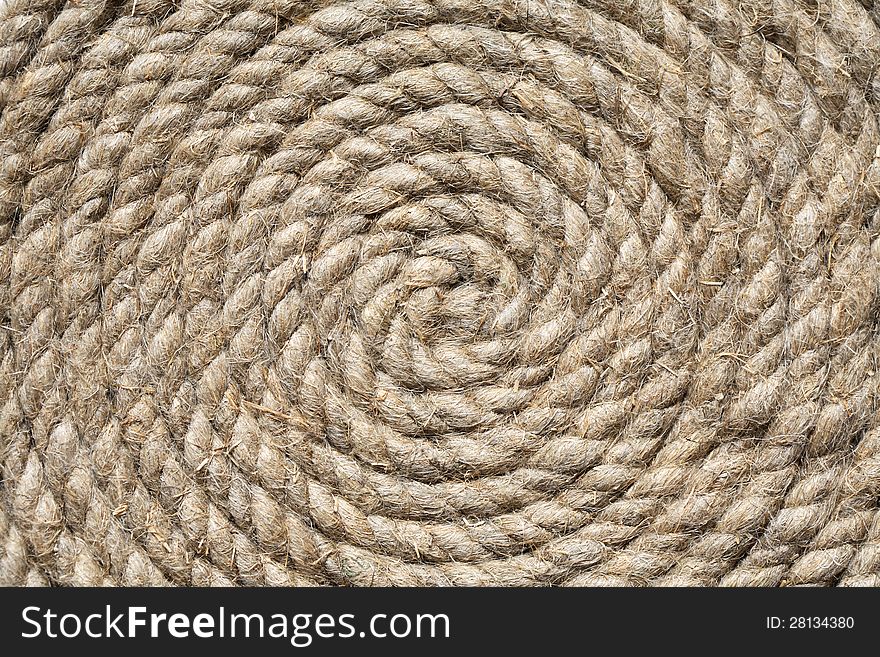 Coil of old hemp rope closeup. Nice background. Coil of old hemp rope closeup. Nice background