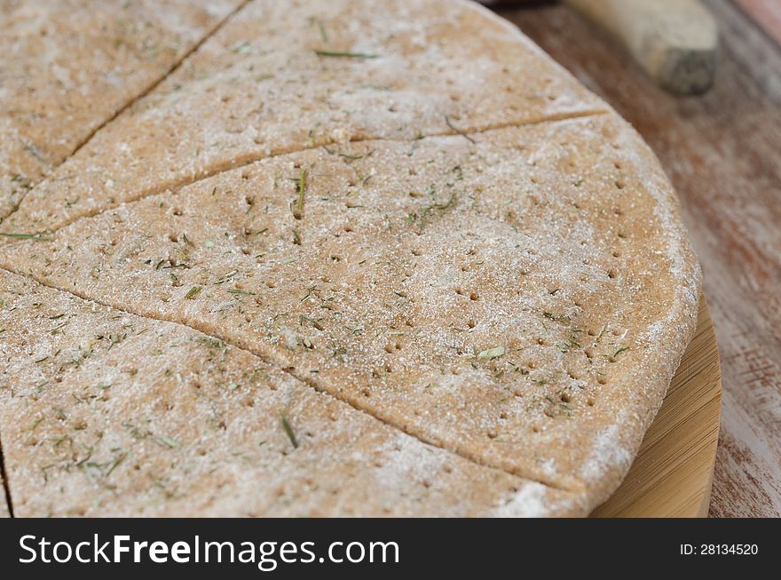 Cut portions flat bread made â€‹â€‹from rye flour with dill. Cut portions flat bread made â€‹â€‹from rye flour with dill