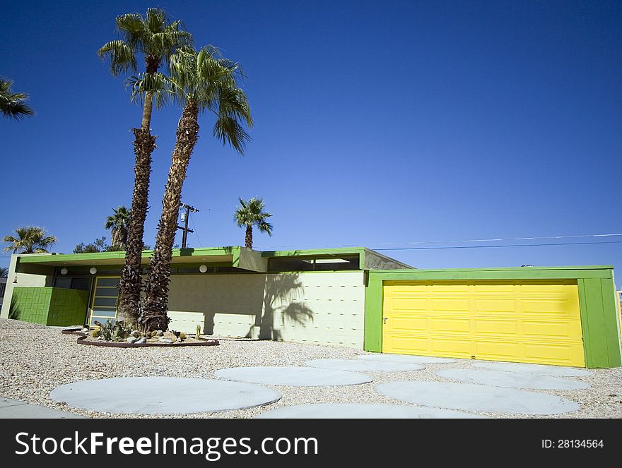 Mid-century modern Palm Springs House with Yellow Garage