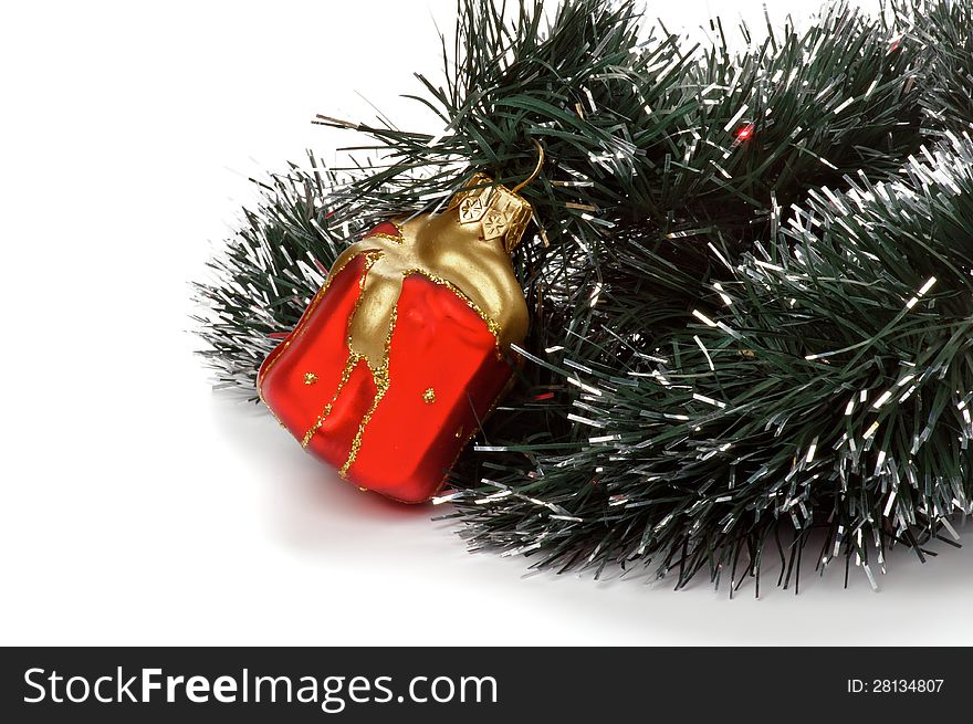 Red Gift Box Ball and Christmas Tree as Christmas Decorations closeup