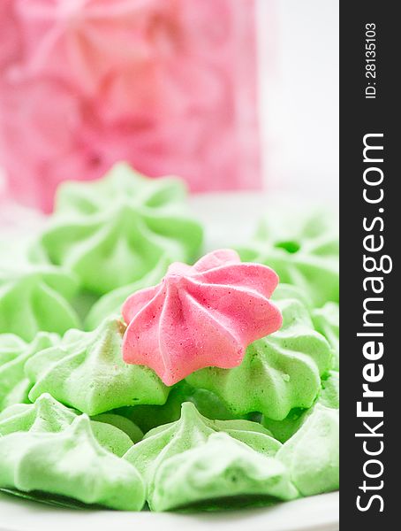 Close-up of pink and green Meringue cookies