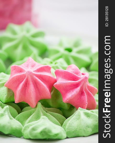 Close-up of pink and green Meringue cookies