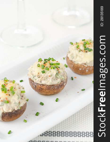 Stuffed mushrooms, baked with cheese and herbs, selective focus