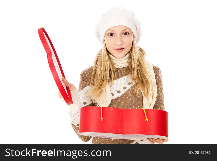 Girl in winter hat with a gift. Girl in winter hat with a gift