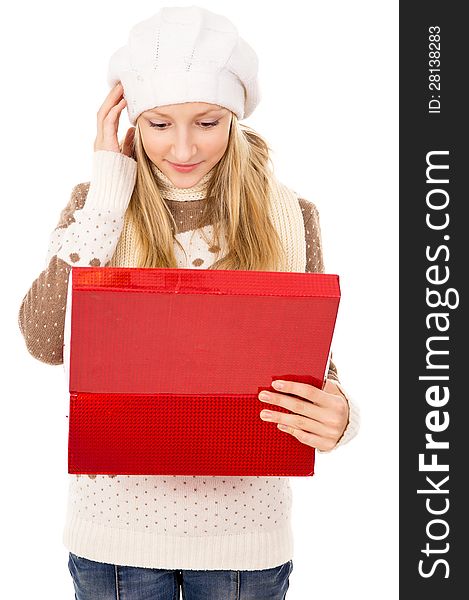 Girl looks in a gift box and wondering isolated