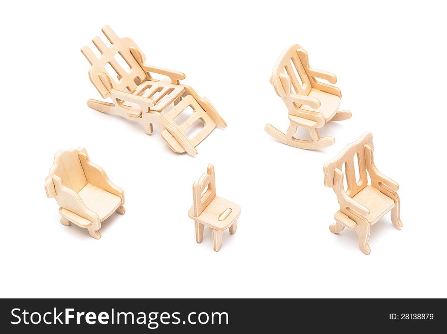 Wooden toy furniture on a white background