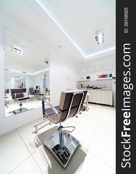 Chairs and mirrors in hairdressing