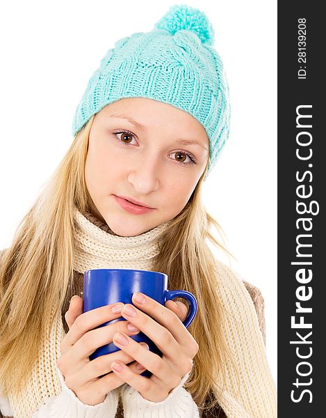 Portrait of a girl in a cap and a mug