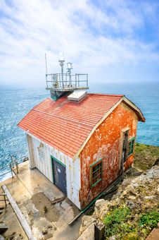 Old House On The Edge And The Blue Ocean Stock Photo Old House On The Edge And The Blue Ocean Stock Photo