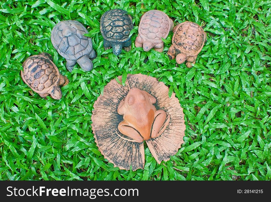 A pottery of frog and turtles on the yard