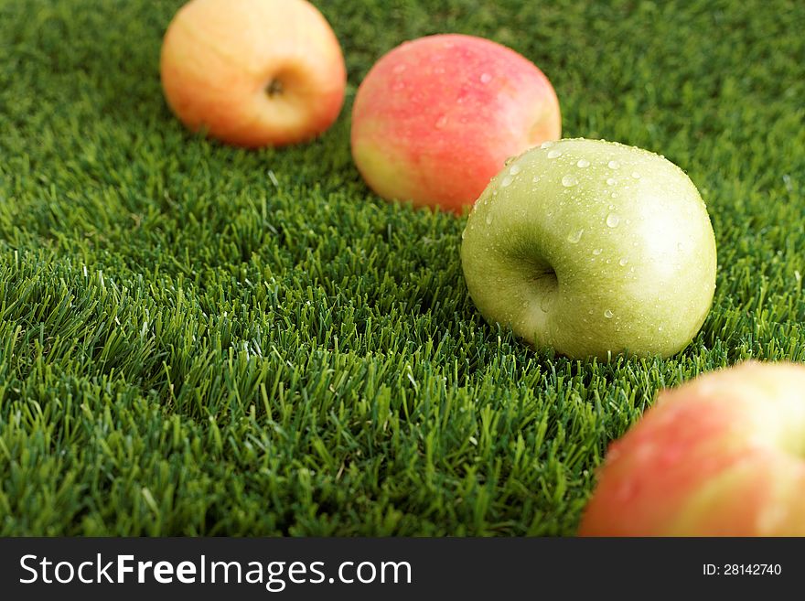 Fortified apples on green fresh grass. Fortified apples on green fresh grass