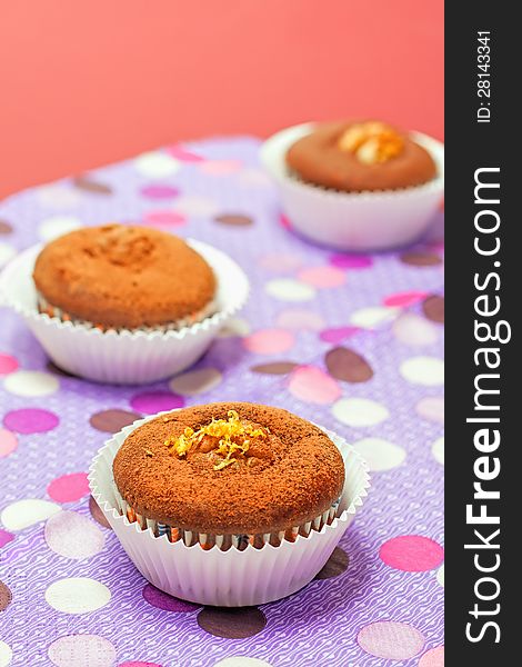 Chocolate cupcakes with on color background