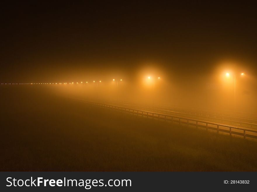 Fog in the light of lamps on an autobath at night. Fog in the light of lamps on an autobath at night