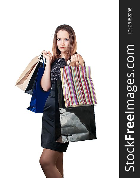 Beautiful woman with shopping bag. Isolated on white background.