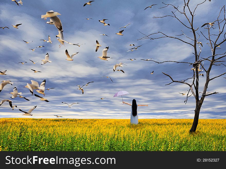 Young Girl Standing On Flower Field