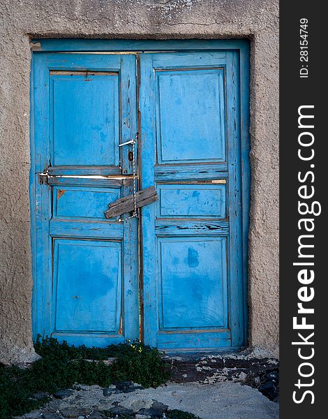 Old door of blue color. Santorini Island, Greece