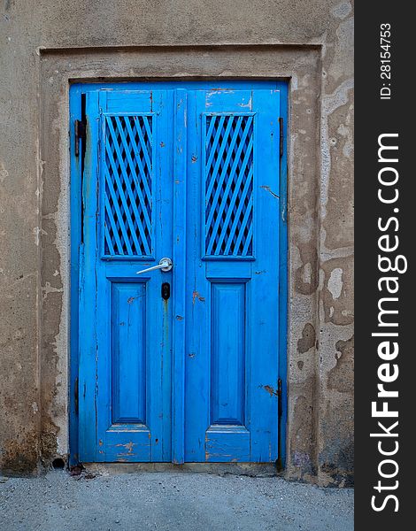 Old door of blue color. Santorini Island, Greece