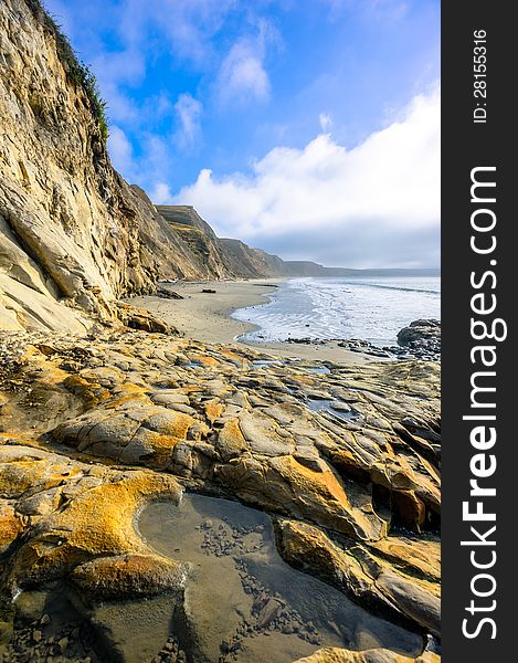 Beautiful landscape of long coastline in a sunny day with blue sky and the clouds. Beautiful landscape of long coastline in a sunny day with blue sky and the clouds