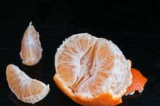 Half Peeled Tangerine With Rind And Two Slices Royalty Free Stock Image Half Peeled Tangerine With Rind And Two Slices Royalty Free Stock Image