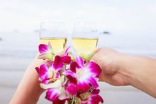 Two Hands, Glasses Of Champagne And A Bouquet Of Orchids. Stock Photo Two Hands, Glasses Of Champagne And A Bouquet Of Orchids. Stock Photo
