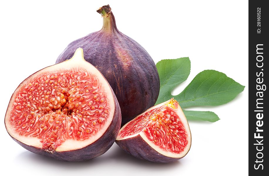 Figs with leaves on a white background. Figs with leaves on a white background.