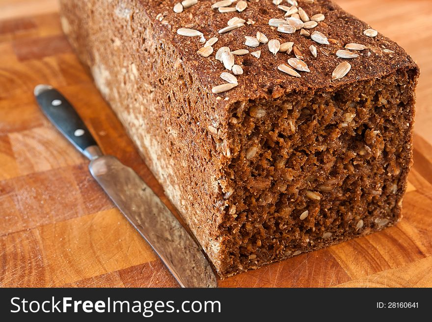 Freshly made healthy black bread with sunflower seeds and grains