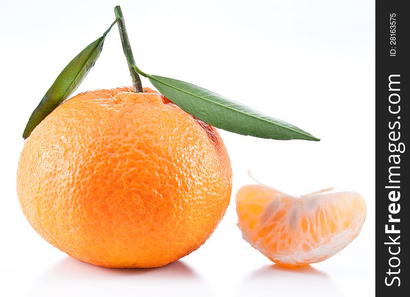 Tangerines with leaves on a white background. Tangerines with leaves on a white background.