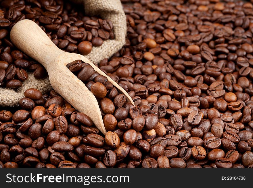 Coffee beans with wooden scoop