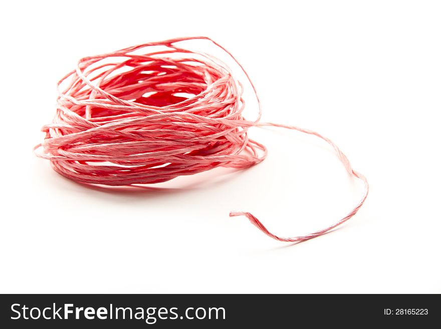 Red string abstract wad isolated on white background