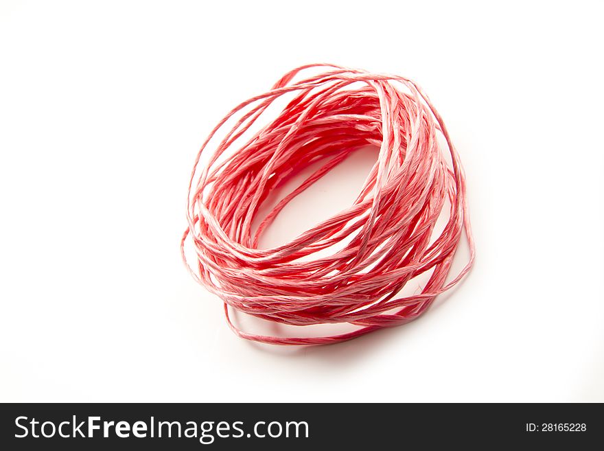 Red string abstract wad isolated on white background