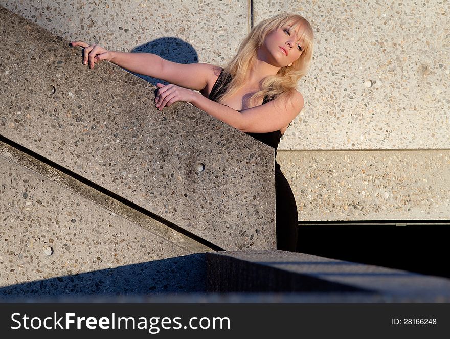 An image of a beautiful young woman outdoors during sunset. An image of a beautiful young woman outdoors during sunset