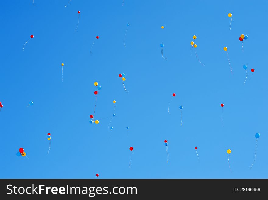 A lot of balloons in the blue sky