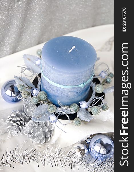 Close up blue candle decorated with christmas ornament. Close up blue candle decorated with christmas ornament