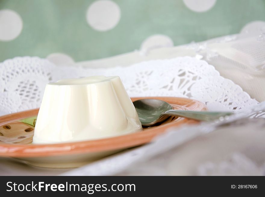 Milk pudding dessert serve on plate with sweet background