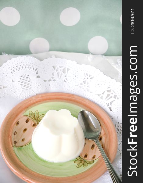 Milk pudding serve on plate with polka dots background
