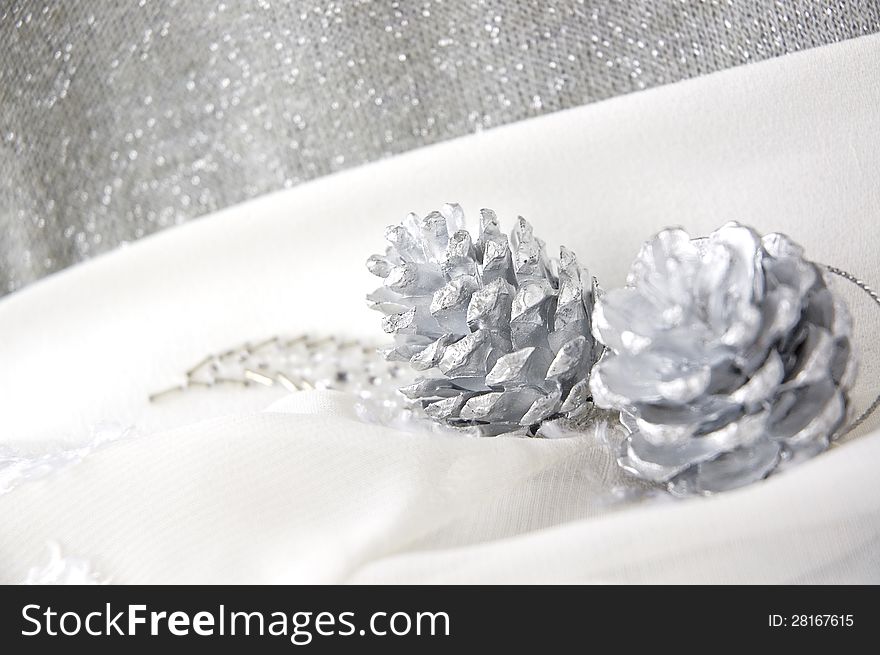 Close up silver pine cones on white background