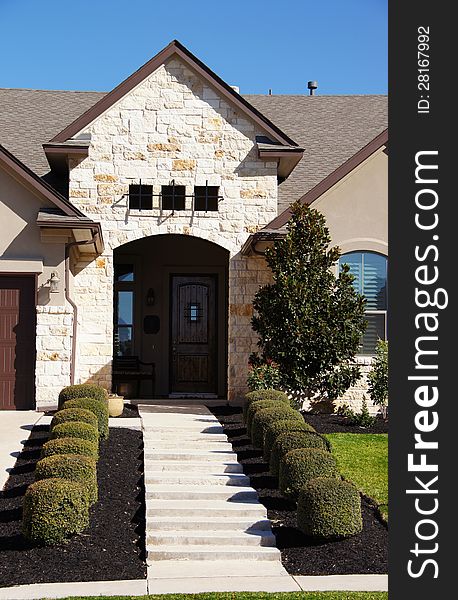 Super cute bungalow stucco house with pretty front yard. Super cute bungalow stucco house with pretty front yard.